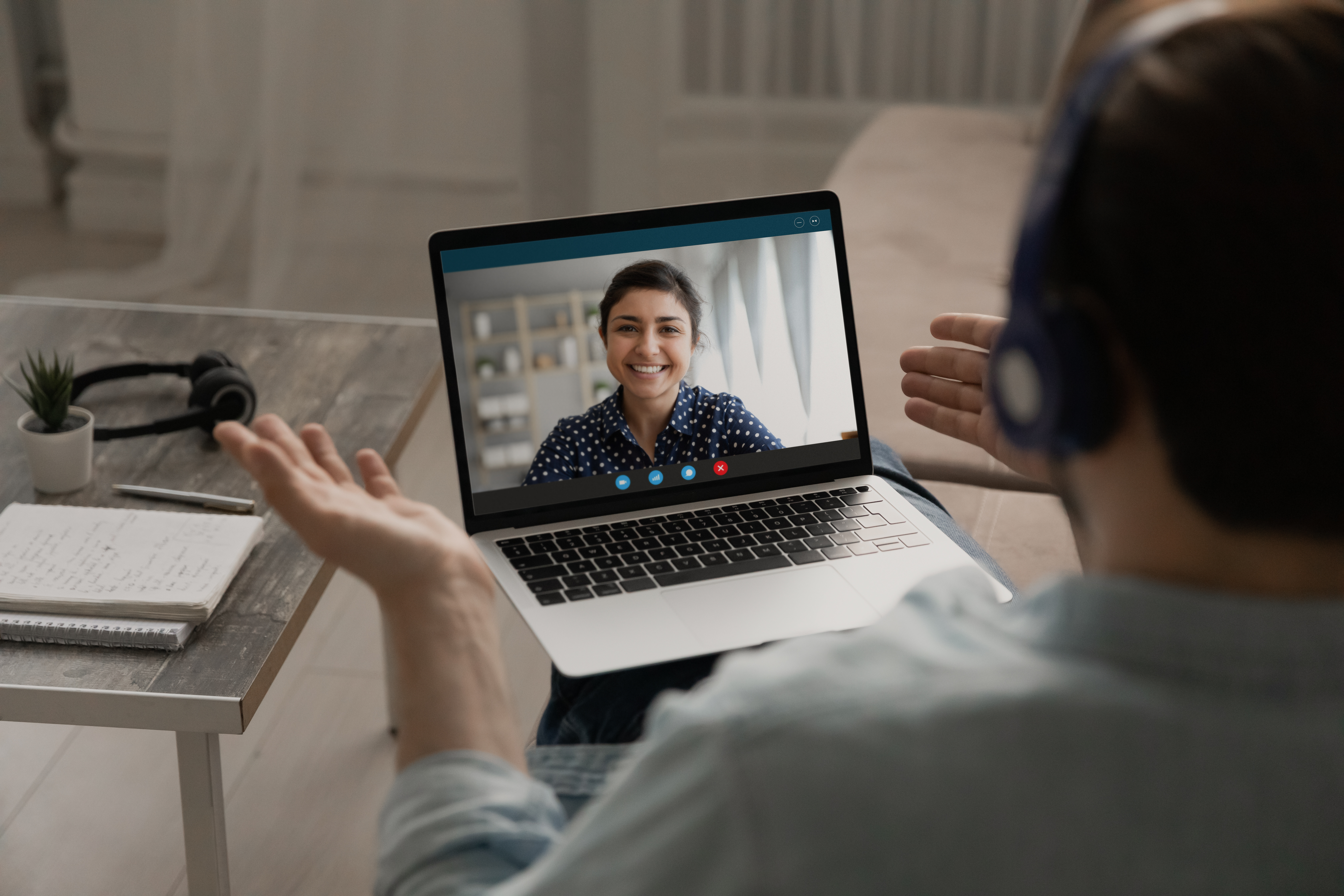 man talking to woman on laptop