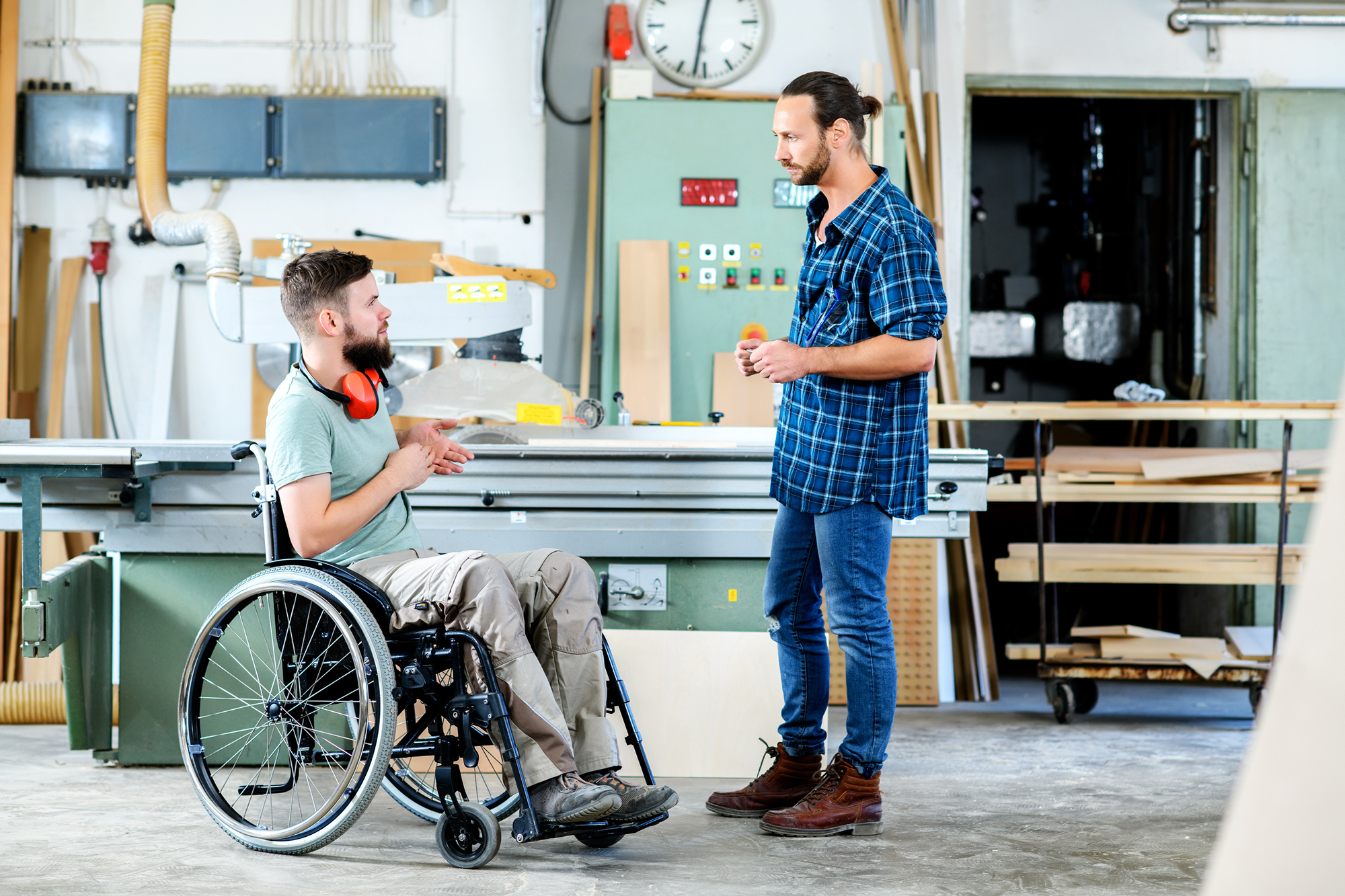 man in wheelchair in woodworking shop